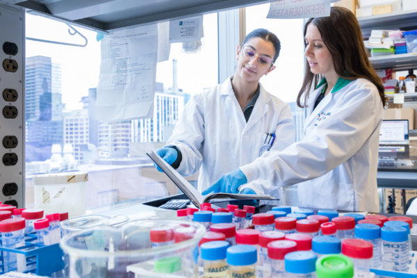 Two woman looking at documents in a laboratory