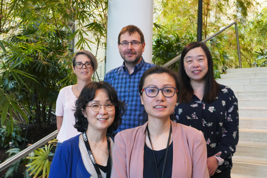 a group of people smiling at the camera